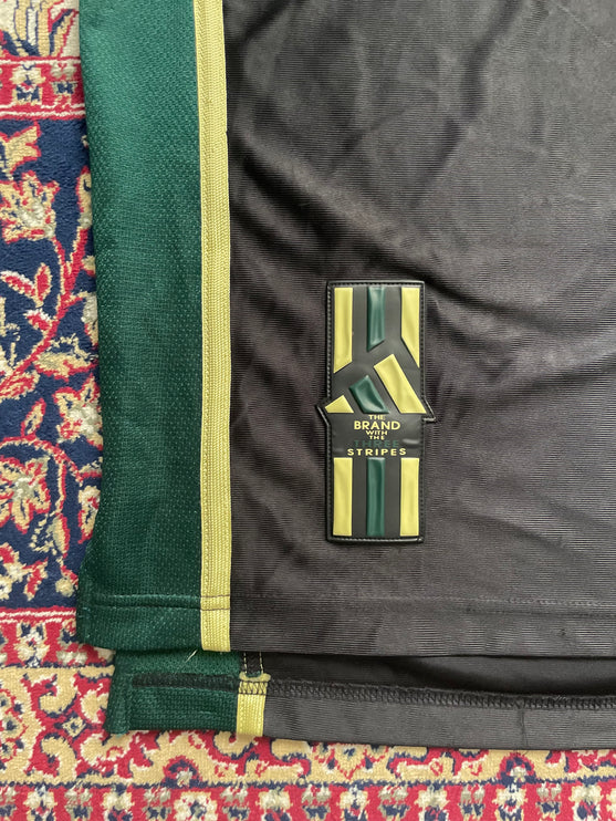 Black and green adidas jersey