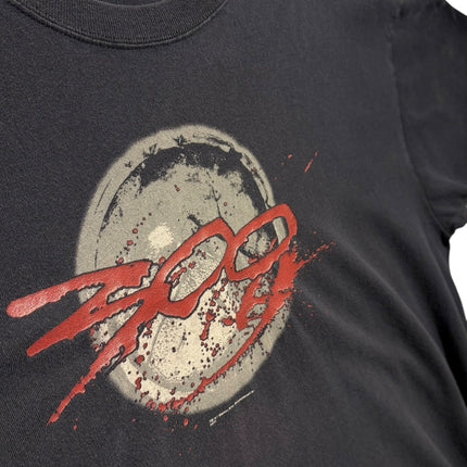 OutOf10 black cotton crewneck t-shirt featuring a distressed 300 movie logo and weathered shield graphic