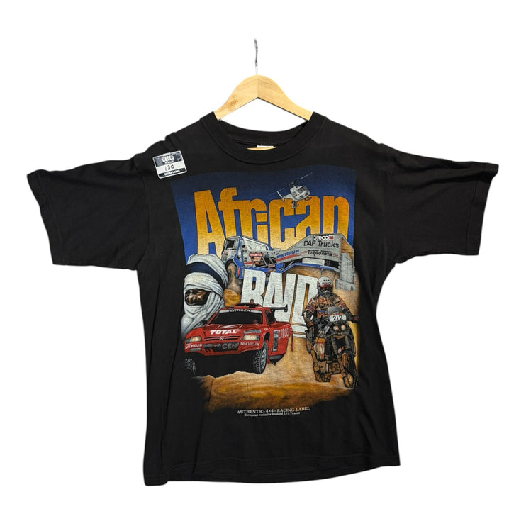 OutOf10 black cotton t-shirt featuring a vintage African Raid rally graphic print with desert racing cars and bikes.