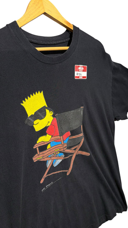 OutOf10 black cotton crew-neck t-shirt featuring a graphic print of Bart Simpson wearing sunglasses in a chair.