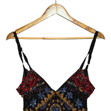OutOf10 black sleeveless crop top with intricate red, blue, and gold beaded embroidery and adjustable straps.