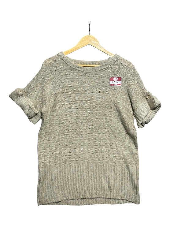 OutOf10 beige short sleeve knit sweater with crew neck, cuffed sleeves with button tabs, and ribbed hem on a hanger.