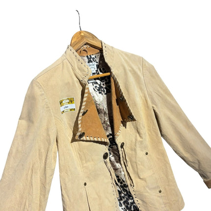 OutOf10 beige suede leather jacket featuring decorative whipstitch collar and animal print lining on a wooden hanger