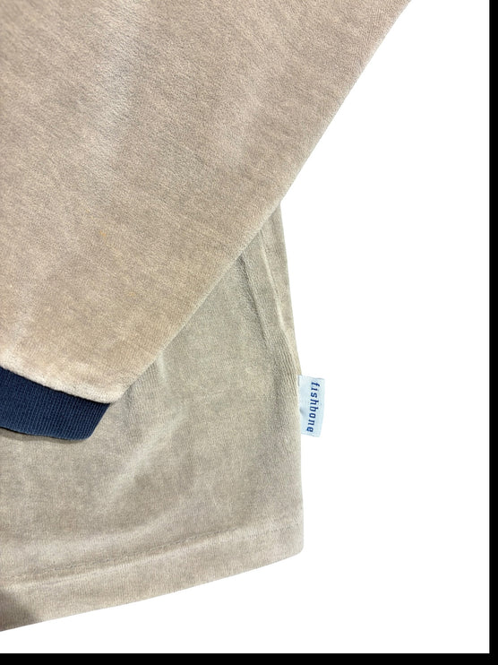 OutOf10 beige velour long sleeve sweatshirt featuring a navy ribbed cuff and a small Fishbone branded side tab.