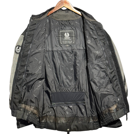 OutOf10 Belstaff motorcycle jacket interior view showing black branded lining, mesh ventilation, and phoenix logo.