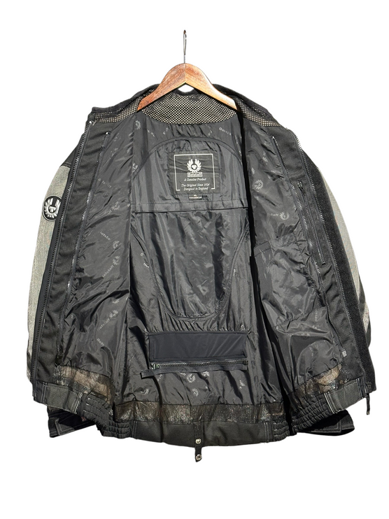 OutOf10 Belstaff motorcycle jacket interior view showing black branded lining, mesh ventilation, and phoenix logo.
