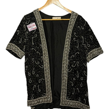 OutOf10 black open-front cardigan jacket with intricate silver and white hand-beaded patterns and ornate border trim.