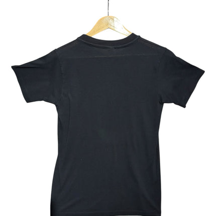 OutOf10 black crew-neck t-shirt seen from the back, hanging on a wooden hanger against a plain white background.