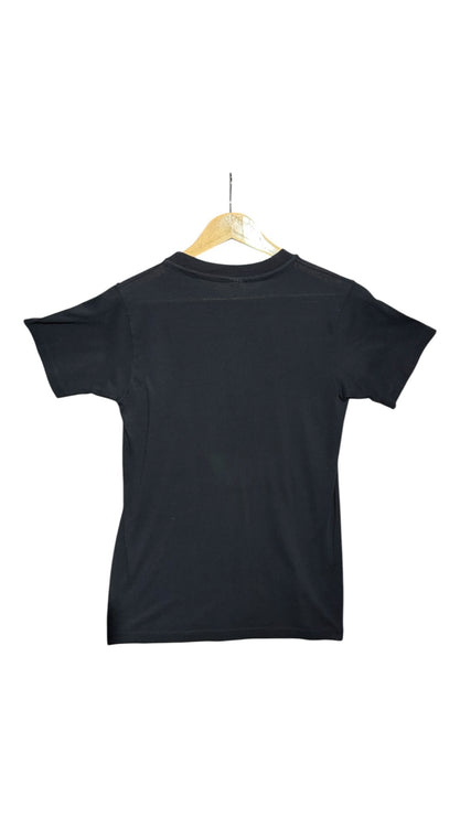 OutOf10 black crew-neck t-shirt seen from the back, hanging on a wooden hanger against a plain white background.