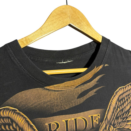 OutOf10 black cotton t-shirt featuring a detailed eagle and motorcycle graphic print with Ride text on a wooden hanger