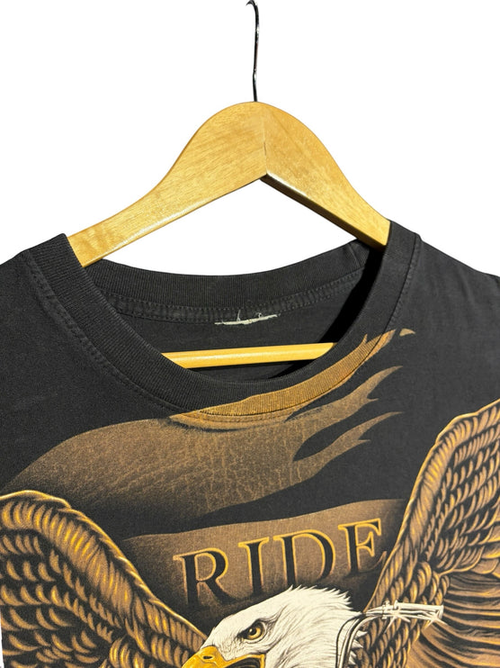 OutOf10 black cotton t-shirt featuring a detailed eagle and motorcycle graphic print with Ride text on a wooden hanger