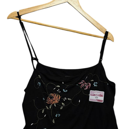 OutOf10 black camisole top with delicate floral embroidery and adjustable spaghetti straps hanging on a wooden hanger