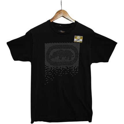 OutOf10 black crew neck t-shirt featuring a pixelated geometric graphic print on the chest, hanging on a wooden hanger.