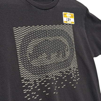 OutOf10 black crew neck t-shirt featuring a pixelated geometric graphic print on the chest, hanging on a wooden hanger.
