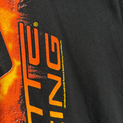 Close-up of OutOf10 black cotton t-shirt featuring a vibrant orange and yellow automotive graphic print
