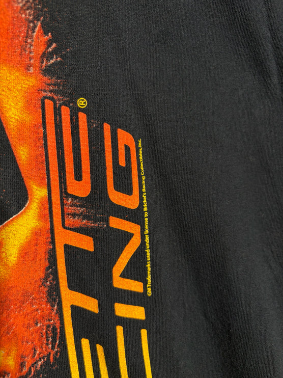 Close-up of OutOf10 black cotton t-shirt featuring a vibrant orange and yellow automotive graphic print