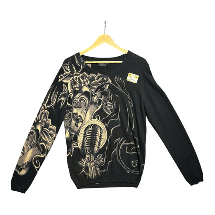 OutOf10 black V-neck sweater featuring a tattoo-inspired panther, microphone, and floral graphic with rhinestones.