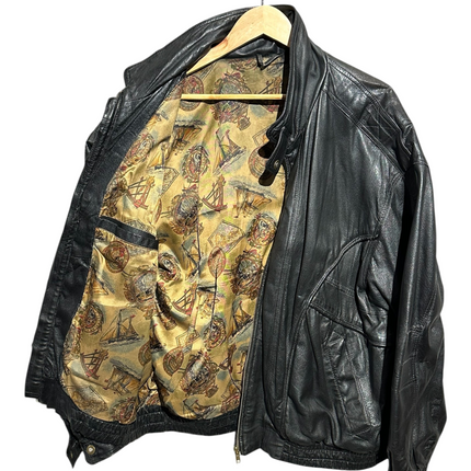 OutOf10 black leather bomber jacket with a vintage nautical print lining, featuring a zip front and ribbed hem.