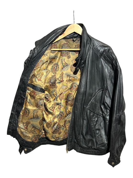 OutOf10 black leather bomber jacket with a vintage nautical print lining, featuring a zip front and ribbed hem.