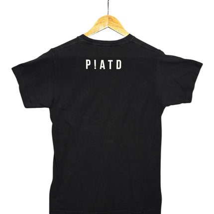 OutOf10 black cotton crewneck t-shirt featuring a minimalist white P!ATD logo on the back, hanging on a wooden hanger.