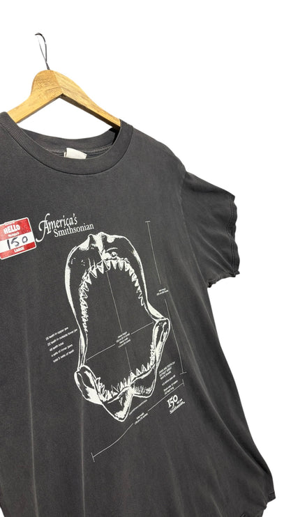 OutOf10 black cotton t-shirt featuring a white technical shark jaw illustration and Smithsonian anniversary graphic.
