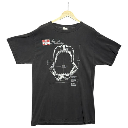 OutOf10 black cotton t-shirt featuring a white technical shark jaw illustration and America's Smithsonian 150 logo.
