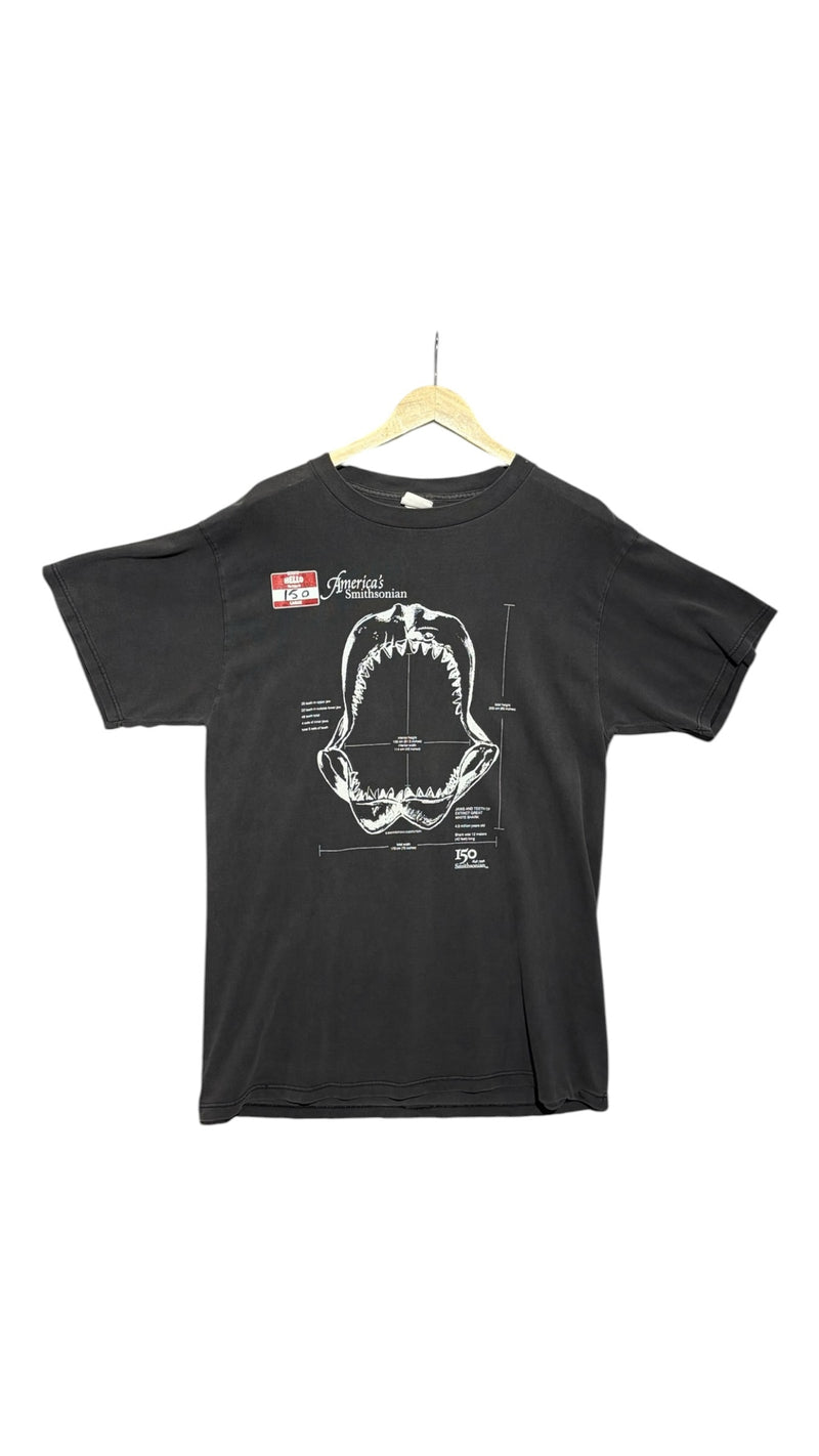 OutOf10 black cotton t-shirt featuring a white technical shark jaw illustration and America's Smithsonian 150 logo.