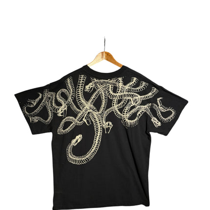 OutOf10 black cotton t-shirt featuring a detailed white snake skeleton graphic wrapping across the back and shoulders.