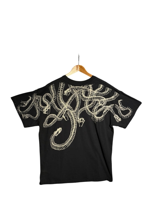 OutOf10 black cotton t-shirt featuring a detailed white snake skeleton graphic wrapping across the back and shoulders.