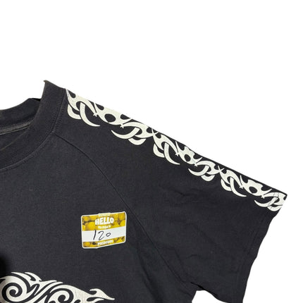OutOf10 black cotton crewneck t-shirt featuring white tribal-inspired graphic prints along the shoulders and sleeves.