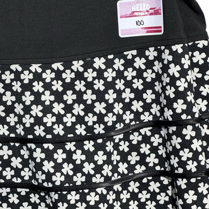 OutOf10 black and white tiered athletic skirt with a clover floral pattern and a wide comfortable waistband