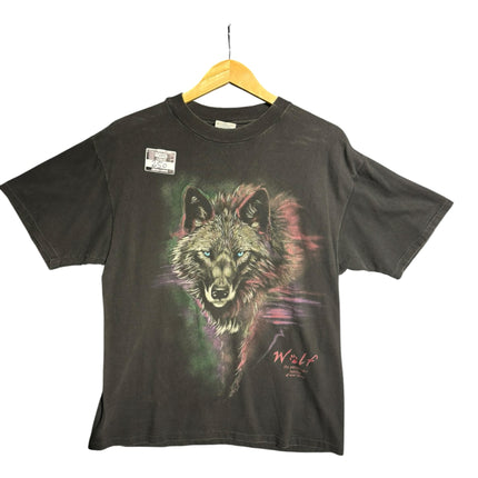OutOf10 black cotton t-shirt featuring a vibrant wolf graphic with green, purple, and pink accents on a hanger.