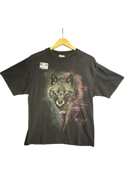 OutOf10 black cotton t-shirt featuring a vibrant wolf graphic with green, purple, and pink accents on a hanger.