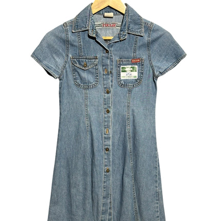 OutOf10 vintage-inspired blue denim mini dress with short sleeves, collar, button-down front, and two chest pockets.