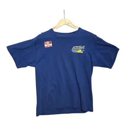 OutOf10 blue cotton t-shirt with Movie World logo on the chest, hanging on a wooden hanger against a white background.