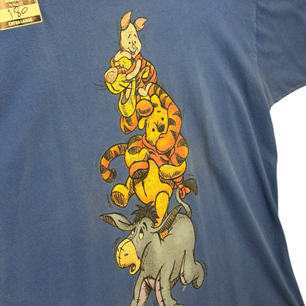 OutOf10 blue cotton crewneck t-shirt featuring a stacked Winnie the Pooh, Tigger, and Piglet graphic illustration.