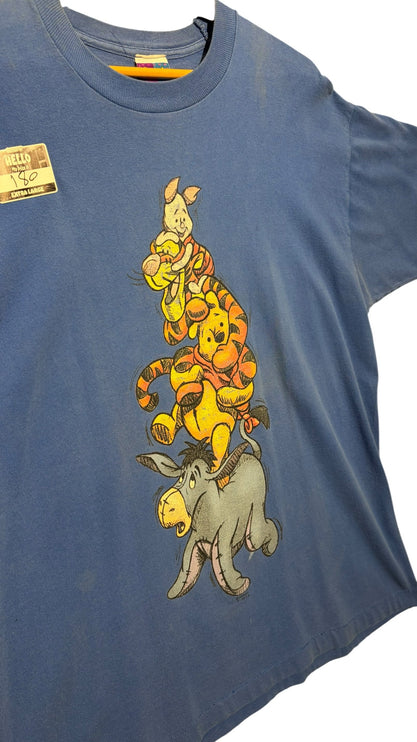 OutOf10 blue cotton crewneck t-shirt featuring a stacked Winnie the Pooh, Tigger, and Piglet graphic illustration.