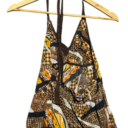 OutOf10 bohemian halter neck top featuring a vibrant geometric print in brown, orange, and cream with ruffle details.
