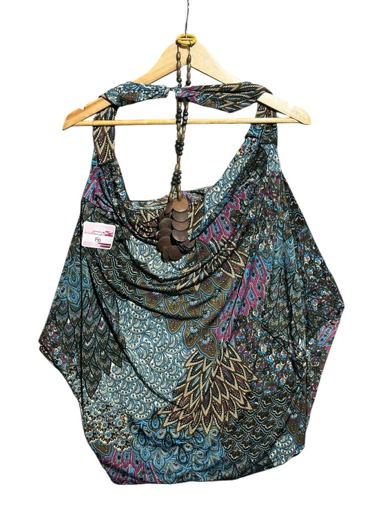 OutOf10 bohemian shoulder bag in teal and purple paisley print with wooden bead accents on a wooden hanger
