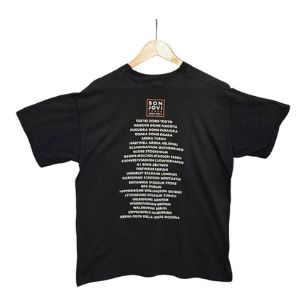 Back view of OutOf10 black cotton Bon Jovi concert tour t-shirt featuring a list of global venues and tour dates.