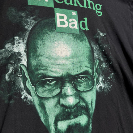 OutOf10 black cotton t-shirt featuring a green Walter White portrait and Breaking Bad logo graphic print