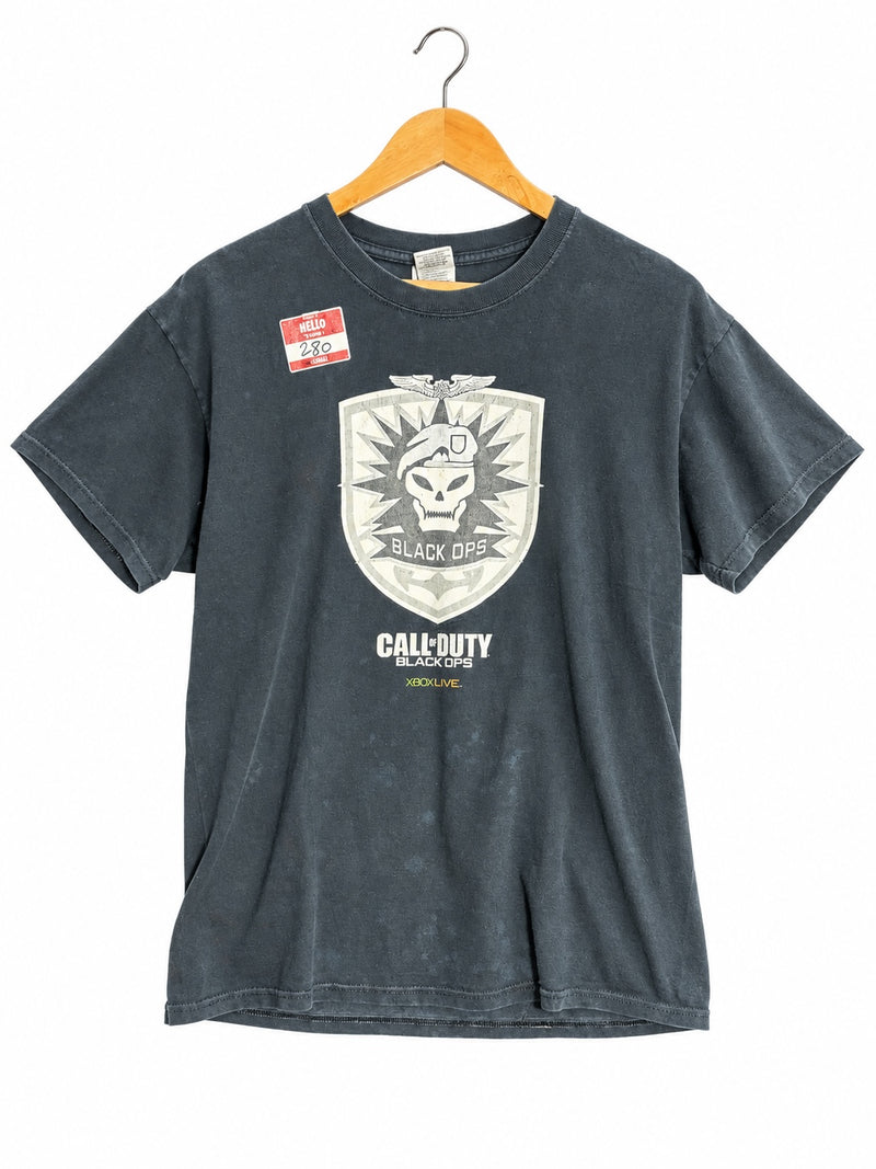 OutOf10 black Call of Duty Black Ops graphic cotton t-shirt with distressed skull emblem on a wooden hanger