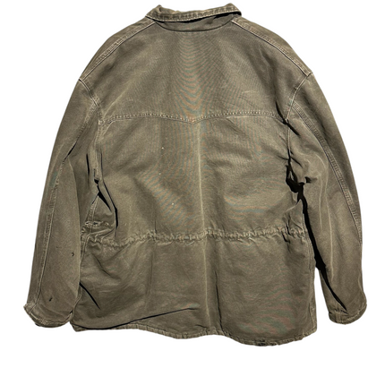 Back view of a vintage OutOf10 Carhartt brown cotton canvas field jacket with a drawstring waist and distressed finish.