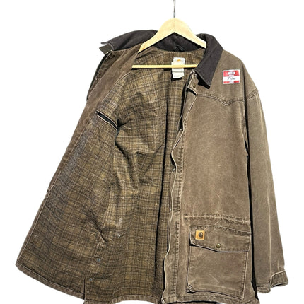 OutOf10 Carhartt brown canvas field jacket with a corduroy collar and warm plaid lining hanging on a wooden hanger.