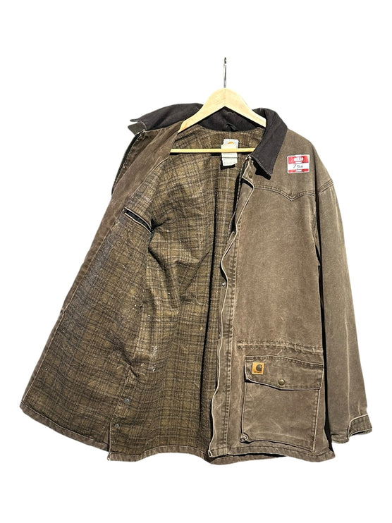 OutOf10 Carhartt brown canvas field jacket with a corduroy collar and warm plaid lining hanging on a wooden hanger.