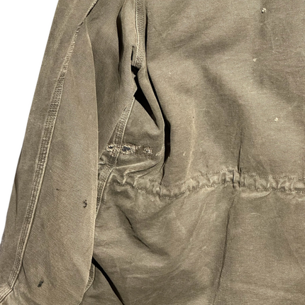 OutOf10 vintage brown Carhartt rugged canvas field jacket showing distressed texture and natural wear marks