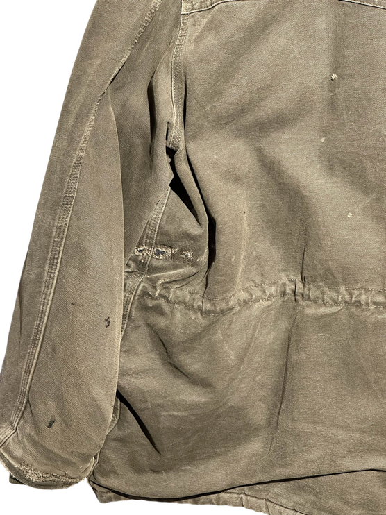 OutOf10 vintage brown Carhartt rugged canvas field jacket showing distressed texture and natural wear marks