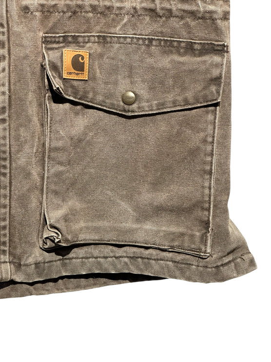 OutOf10 Carhartt brown rugged canvas field jacket featuring a large front pocket with a snap-button and logo patch