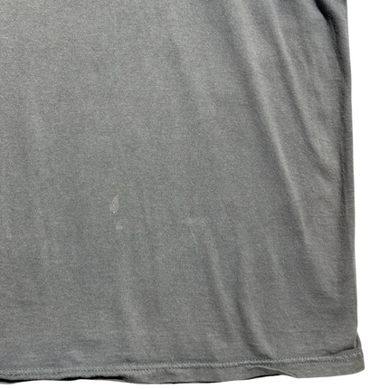 OutOf10 charcoal grey cotton crewneck t-shirt showing a small authentic wear mark on the lower front fabric