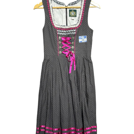 OutOf10 charcoal grey polka dot dirndl dress with hot pink lacing, ruffled neckline, and pleated skirt.
